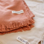 NAYAVITA cotton poncho towel 3-6 years natural and tuscany folded